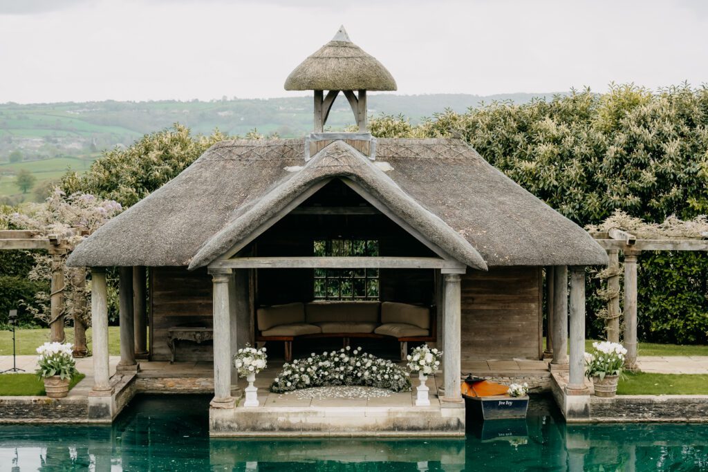 Outdoor wedding ceremony setup at Euridge Manor Cotswolds planned by Knots and Nuptials luxury wedding planner UK