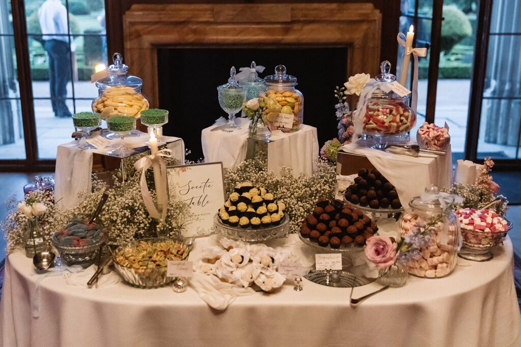 Elegant wedding sweetie table at Ashridge House styled by Knots and Nuptials luxury wedding planner Hertfordshire